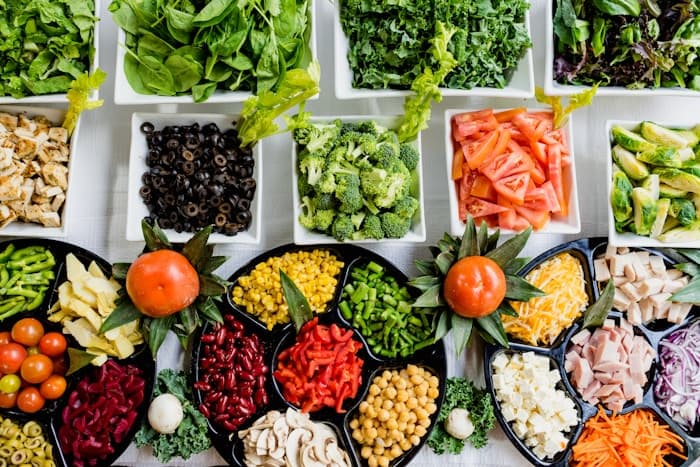Fresh ingredients arranged on a kitchen table